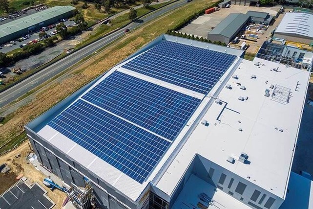 Aerial of Doma hotels and the National Archives rooftop solar arrays in the ACT