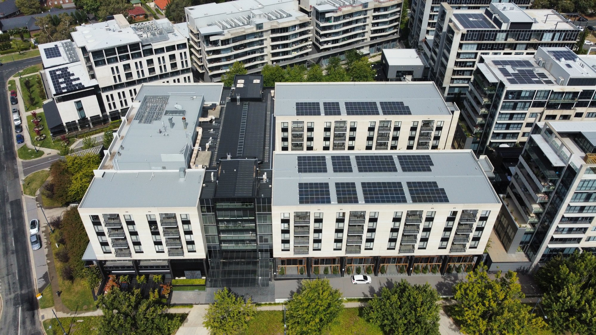 Aerial of Doma hotels and the National Archives rooftop solar arrays in the ACT
