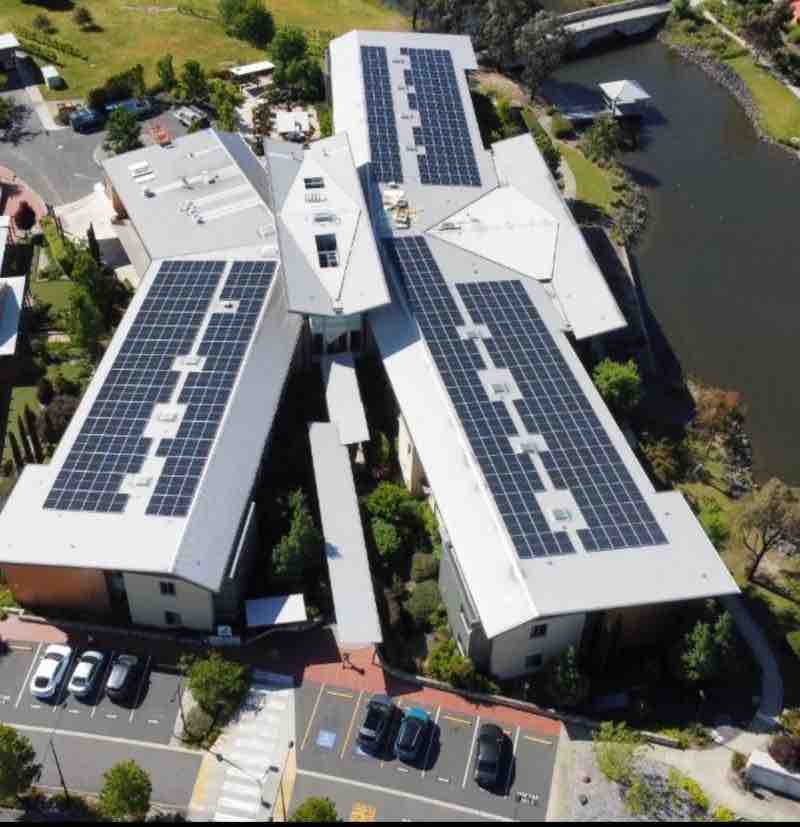 Aerial of Goodwin Monash rooftop solar beside water
