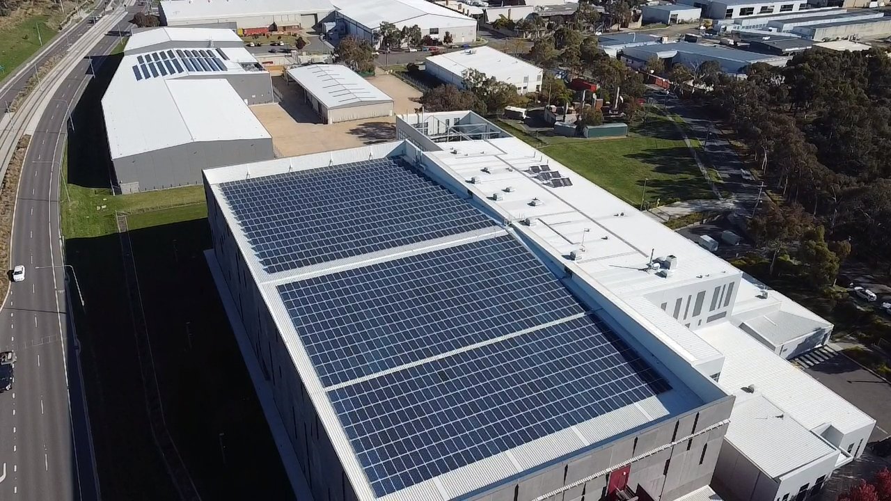Aerial of Doma hotels and the National Archives rooftop solar arrays in the ACT
