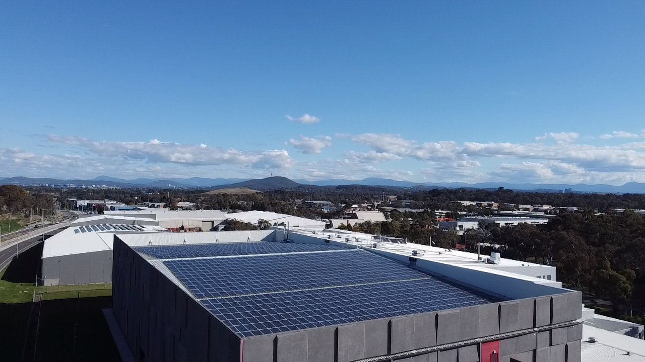 Aerial of Doma hotels and the National Archives rooftop solar arrays in the ACT
